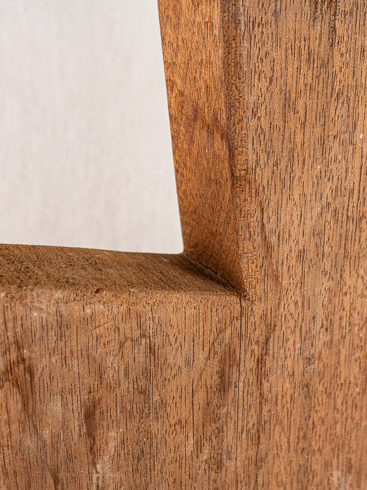Antique French hardwood cutting board, early 20th century, hand-finished with sharp angular corner and pronounced grain texture.