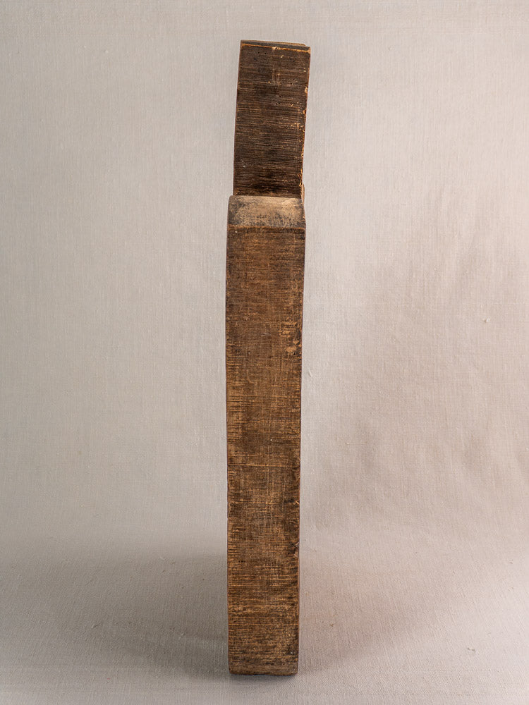 Antique French cutting board with angled top, visible wood grain, and aged patina, circa 1880s farmhouse decor.