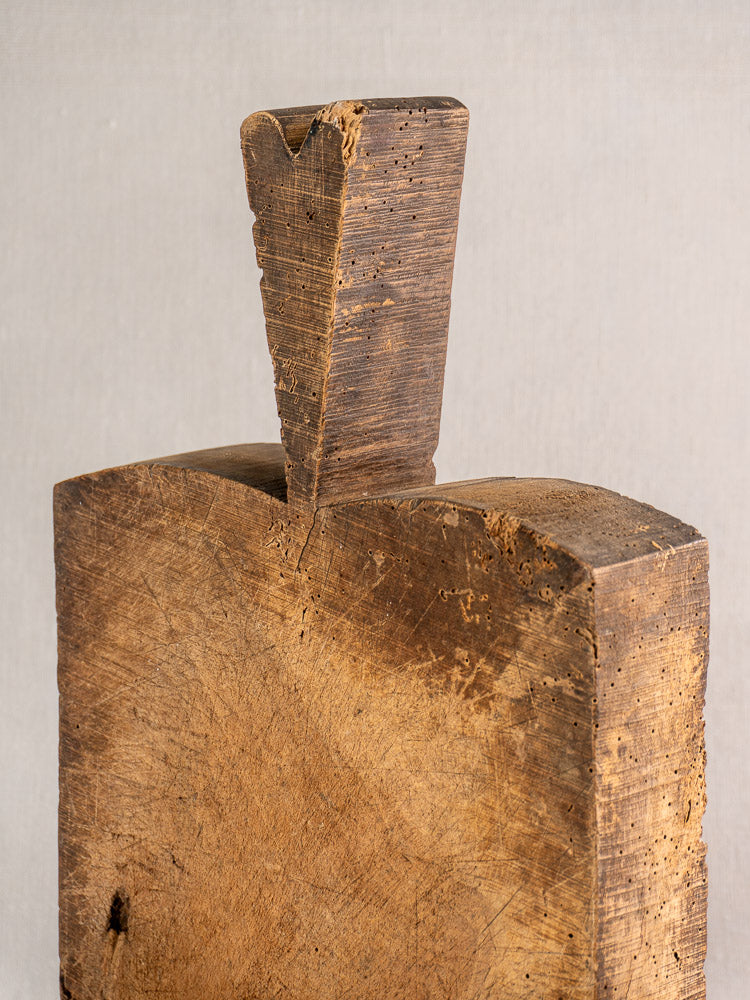 Antique French cutting board, circa 1880s, thick handle and textured wood grain, shown on a light background.
