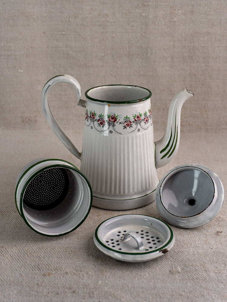 Antique French enamel coffee pot by B.B. Frères, circa 1910–20s, with floral motif and green trim, shown disassembled on fabric.