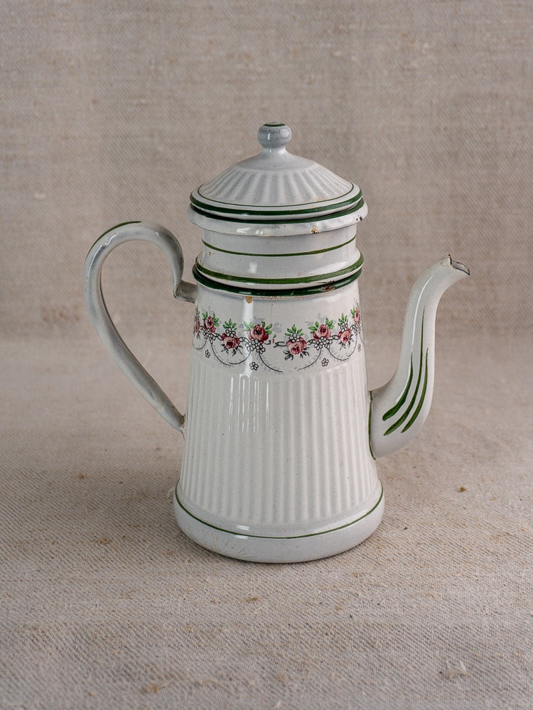 Antique French enamel coffee pot by B.B. Frères, c.1910-20s, with lid, green stripes, floral detail on neutral fabric background.