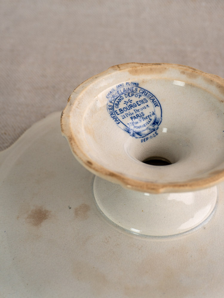 Antique French pedestal cake stand in vintage white faience, E. Bourgeois Paris mark, aged with gentle discoloration.