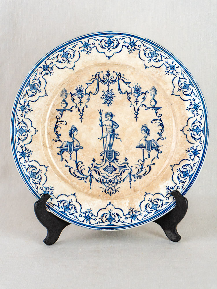 Jules Vieillard Bordeaux Moustiers Service antique French blue faience plate with ornate blue designs and mythological figure on black stand.