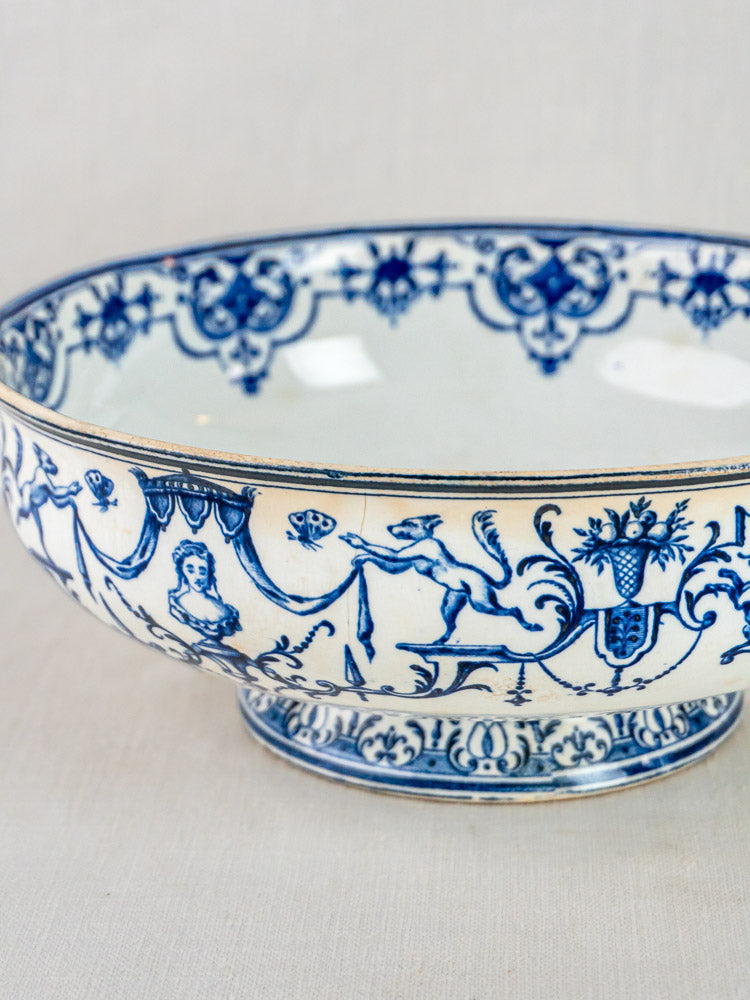 Jules Vieillard Bordeaux Moustiers antique French blue faience bowl with detailed faces, animals, and floral motifs.