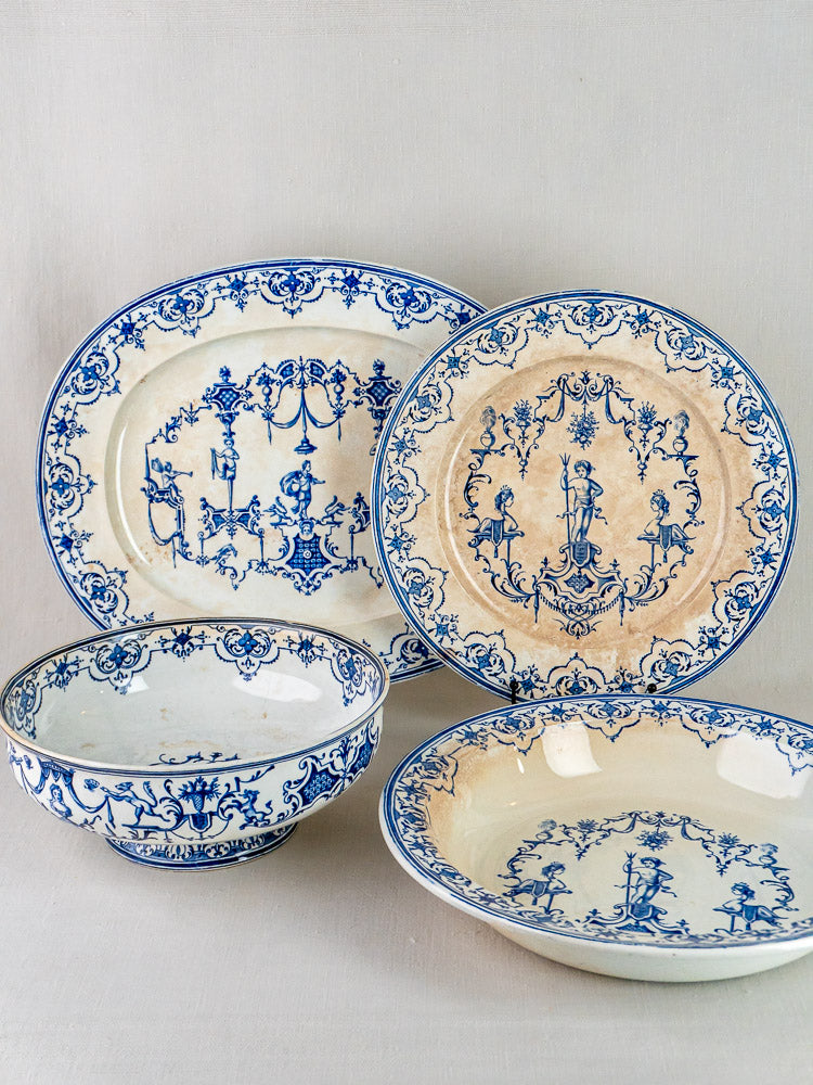 Set of four vintage Jules Vieillard Bordeaux Moustiers ceramic dishes with ornate blue patterns on cream.