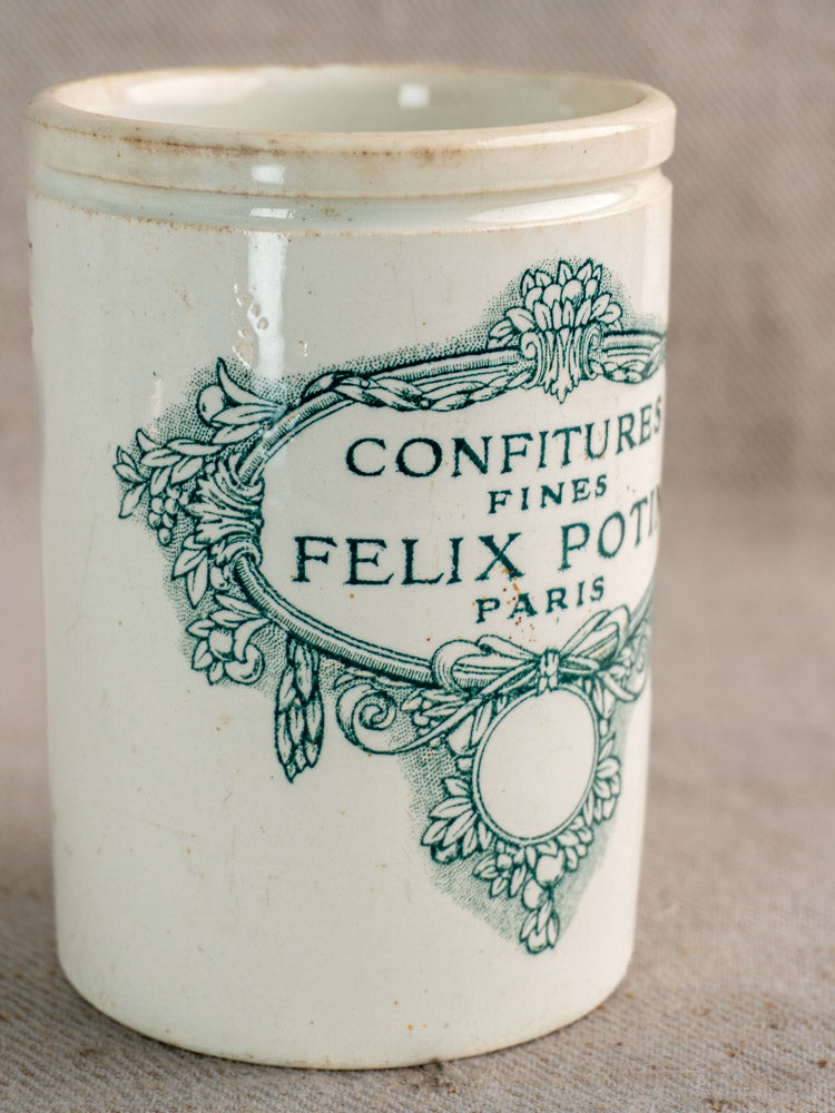 Antique French Felix Potin jam pot, late 19th century white ceramic with ornate floral and ribbon label detailing.