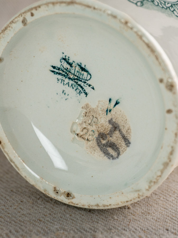 Antique French Felix Potin jam pot base with blue maker’s mark, “FRANCE,” numbers, and rim wear; vintage ceramic style.