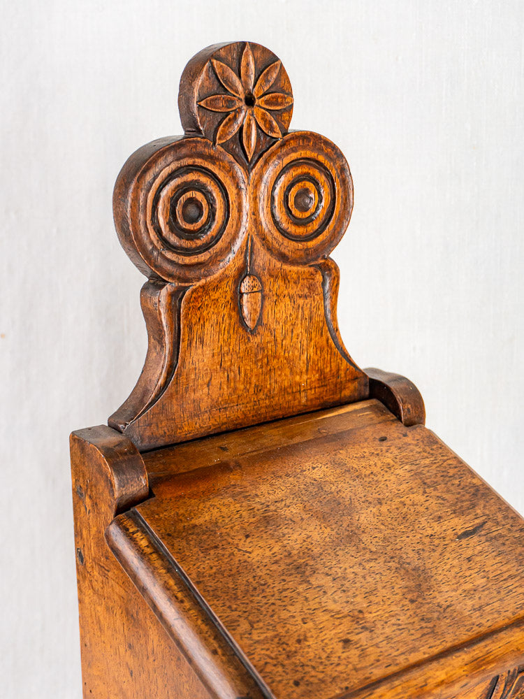 Antique carved walnut French flour and salt box with owl motif and floral detailing.