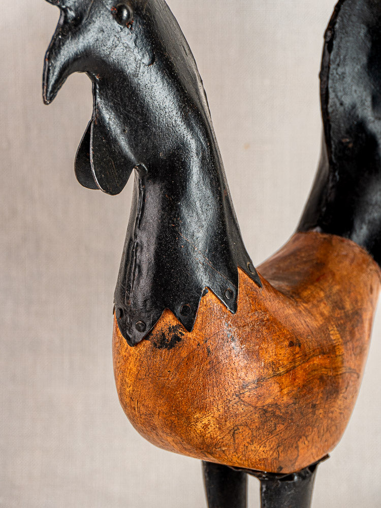 Antique French carved wood and metal rooster sculpture with black head and brown body.