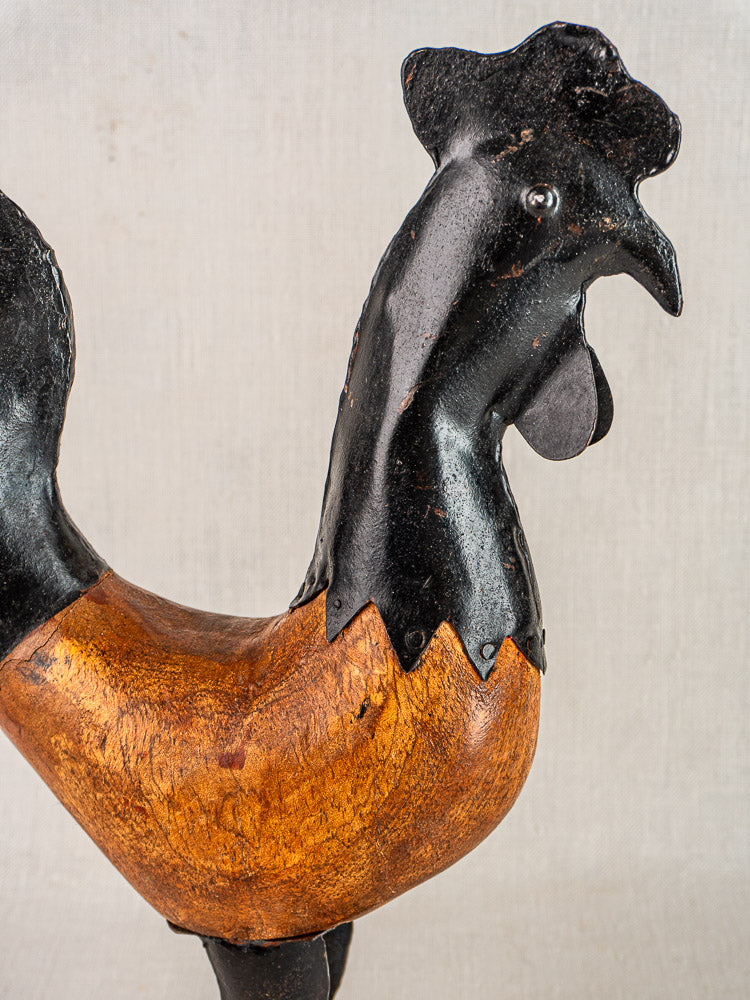 Antique French Folk Art Rooster, circa 1920, carved wood and metal with black head and brown body.