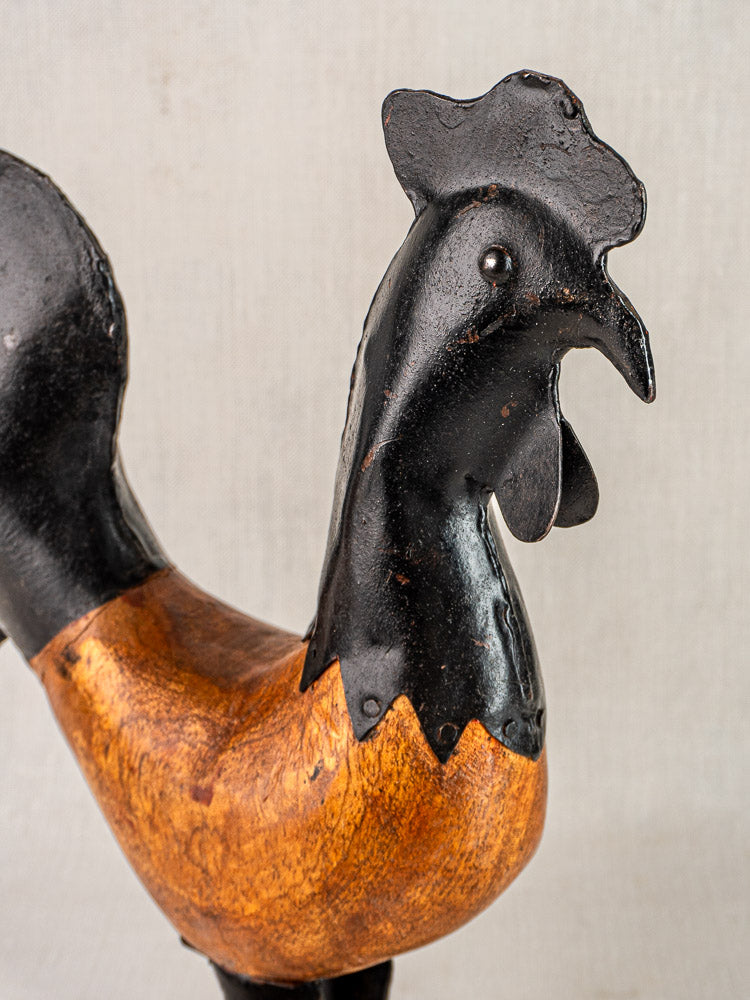 Antique French folk art rooster, circa 1920, carved wood body with black-painted metal details.
