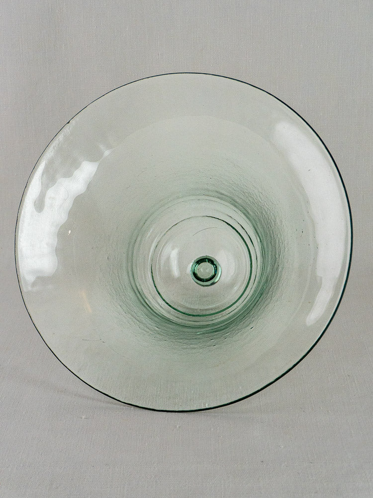 Antique French hand-blown glass cloche with subtle green tint and circular base indentation.