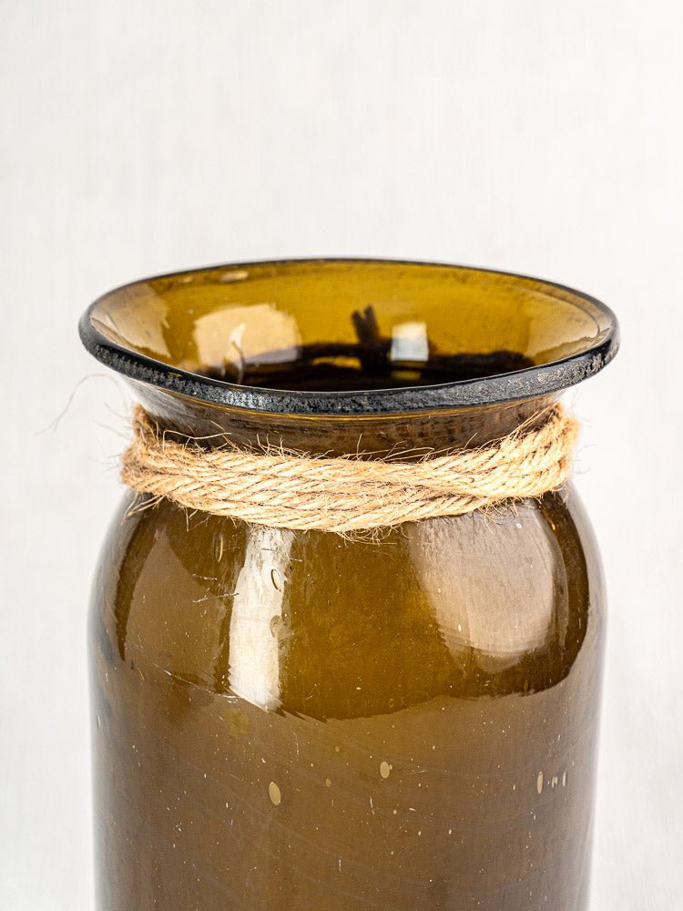 Antique French olive green hand blown glass bocal with wide rim and twine-wrapped neck.
