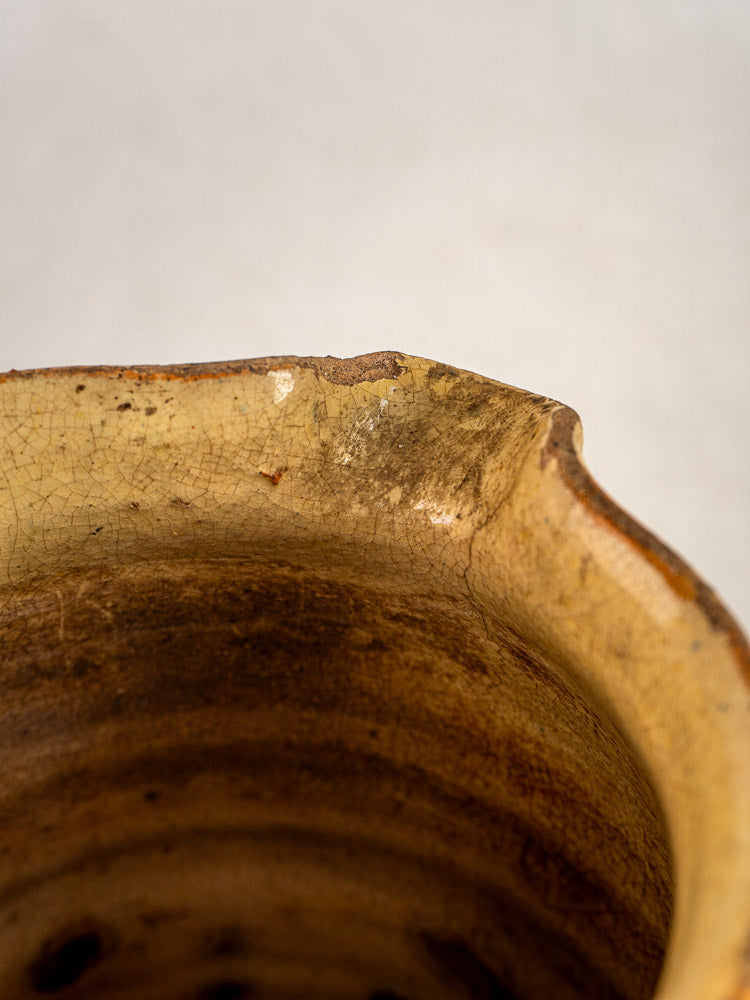 Antique French Jaspé pitcher rim with chipped edge and marbled glaze cracks, Savoie pottery detail.