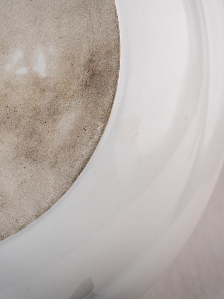 Base of antique Frugier Limoges aluminite bowl, rough unglazed center with marks, glossy glazed rim.