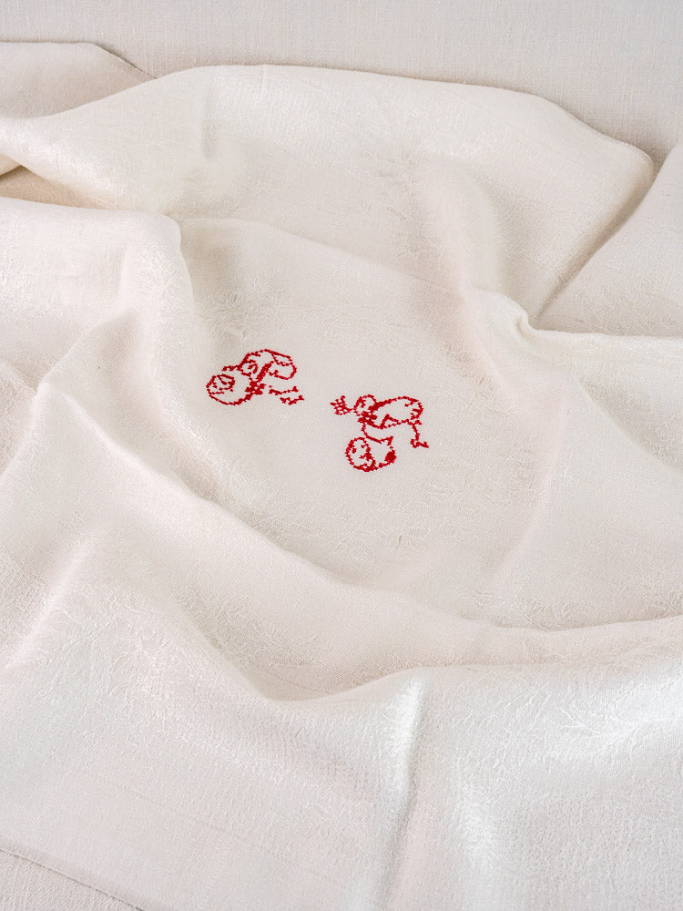 Set of 12 antique French cream damask linen napkins with subtle pattern and red "P.G." initials.