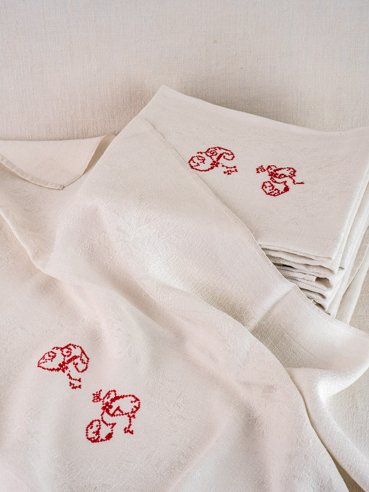 Set of 12 antique French Damask linen napkins, cream with red "P.G." monogram embroidery.