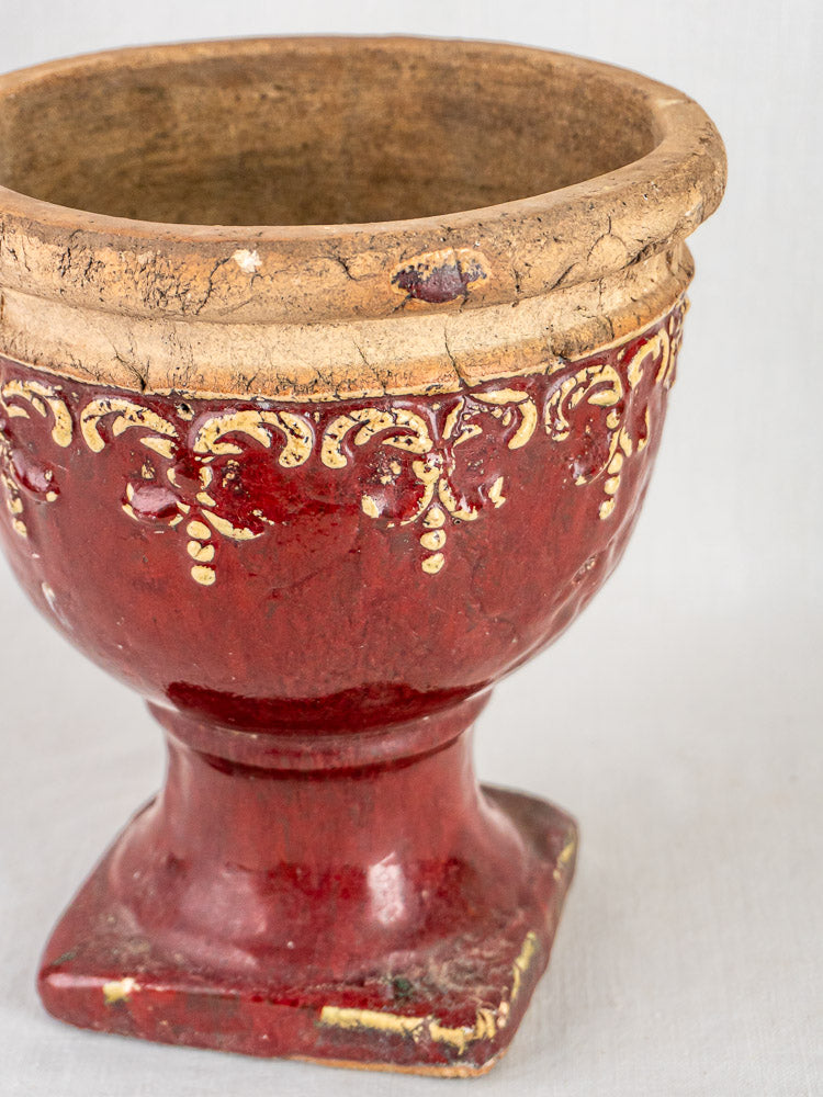 Antique Oxblood French terracotta urn cache-pot with yellow accents, wide rim, and aged square base.