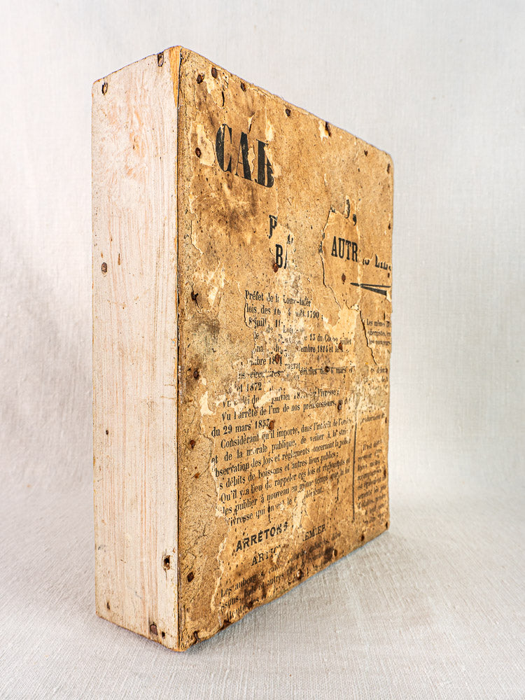 Antique French painted pine casier with nine compartments and weathered frame, faint French script visible.