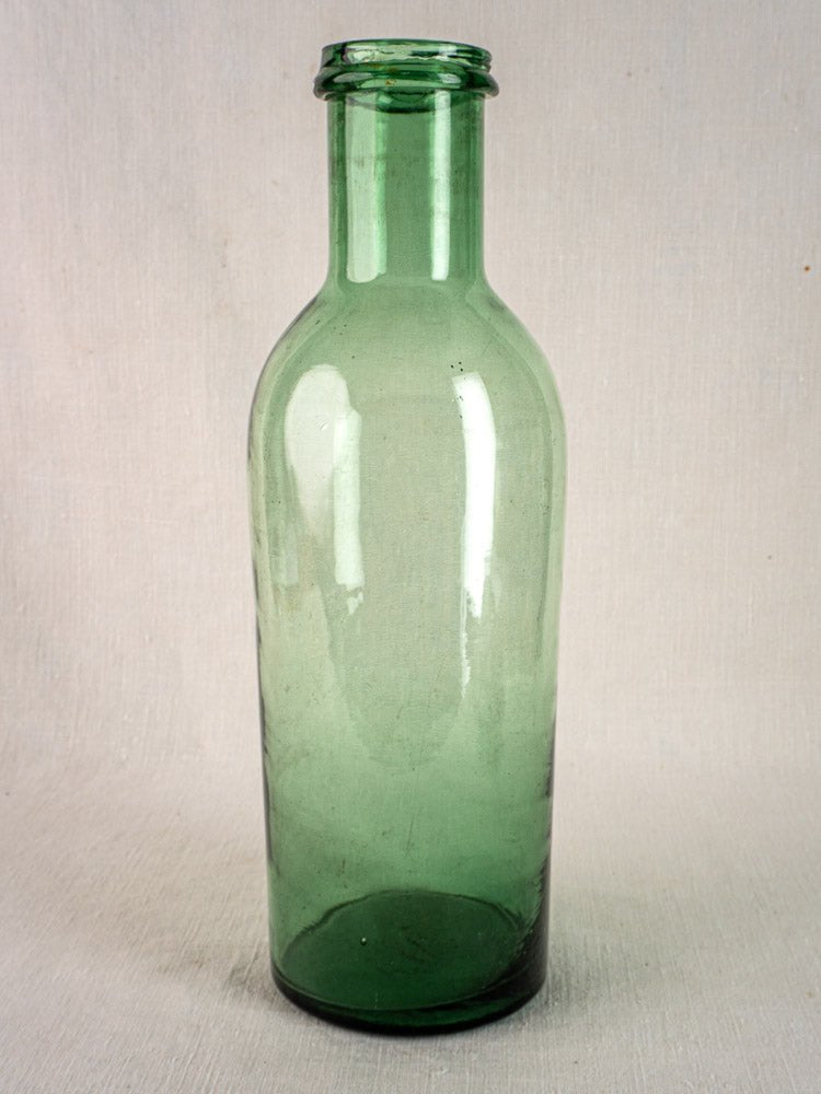 Antique French hand-blown green bubble glass preserves bottle with narrow neck, circa 1900.