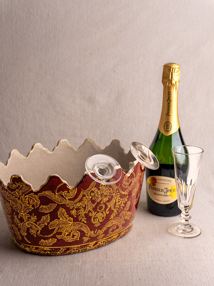 Antique French Terre de Fer ironstone wine cooler with scalloped rim, red and gold floral motifs.