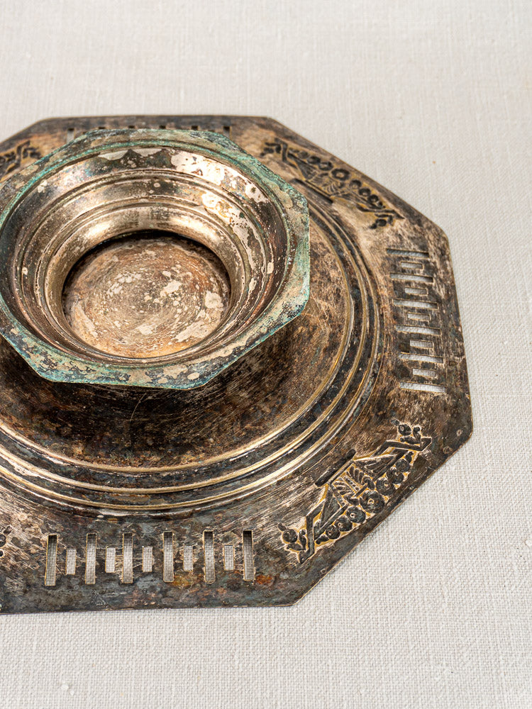 Art Deco French silver plate octagonal footed tazza with geometric engraving on light fabric surface.