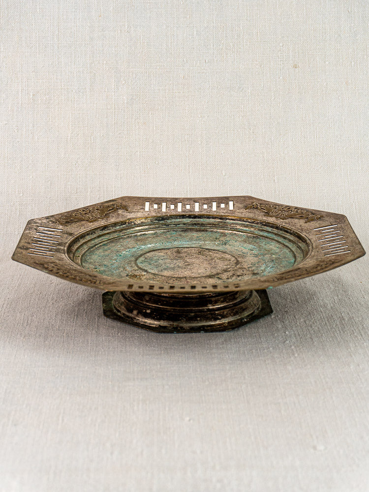 Art Deco French silver plate tazza, octagonal footed coupe with engraved patterns, on light fabric background.