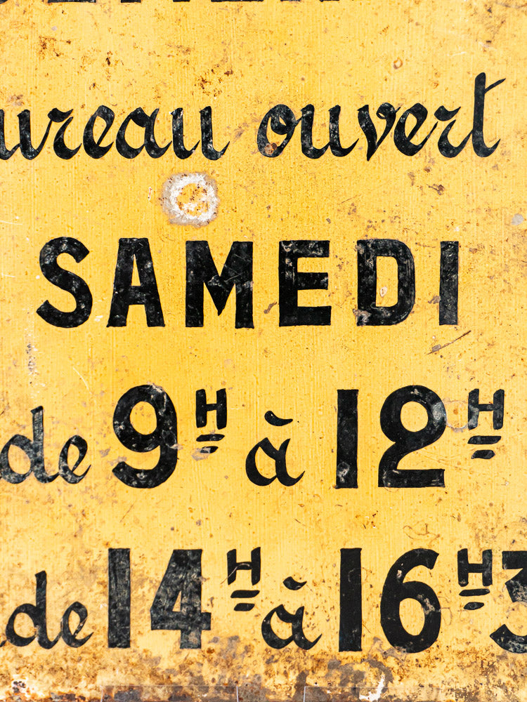 Antique French Société Générale Bank yellow steel sign with black vintage text, weathered and rust spotted.