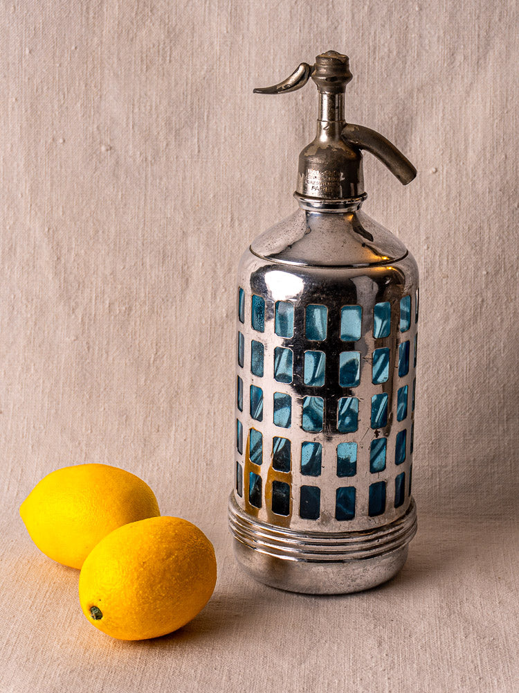 Antique French Gazo-Siphon with silver top and blue glass in lattice, Paris Bistro 1920–1940, on neutral surface.