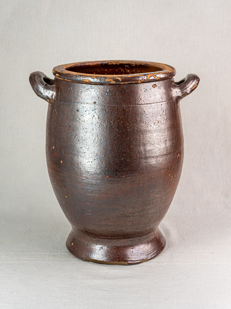 Large antique French salt-glazed stoneware Pot à Graisse with dark brown glossy finish, wide mouth, and two side handles.