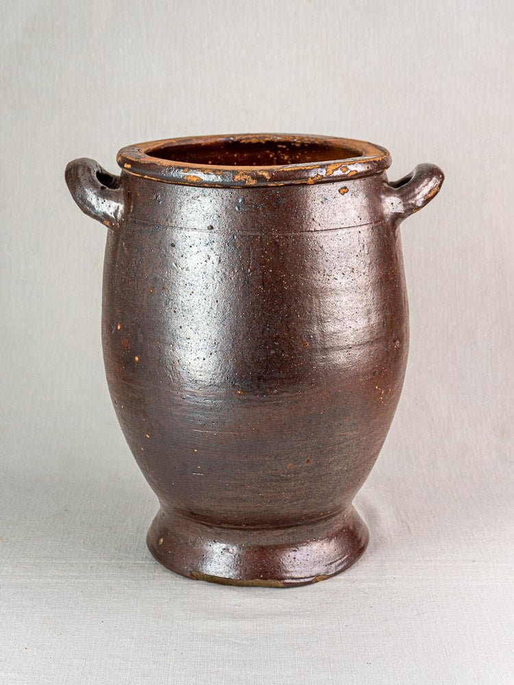Large antique French salt-glazed stoneware Pot à Graisse with dark brown glossy finish, wide mouth, and two side handles.