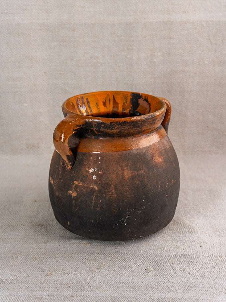 Antique French confit pot, late 19th century, rustic brown earthenware with glazed upper half, matte lower section.