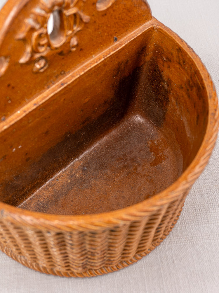 Antique French salt-glazed stoneware salt box with brown wicker-pattern ceramic and ornate backplate, late 19th–early 20th century.