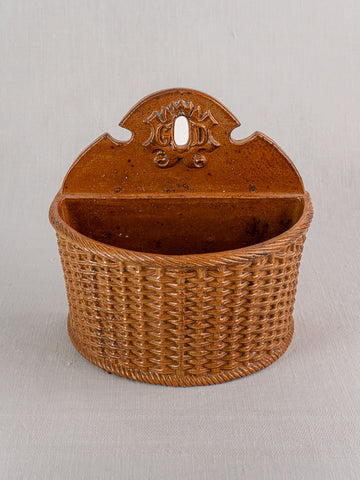 Antique French salt-glazed stoneware salt box with woven basket texture, arched top, and keyhole hanger.