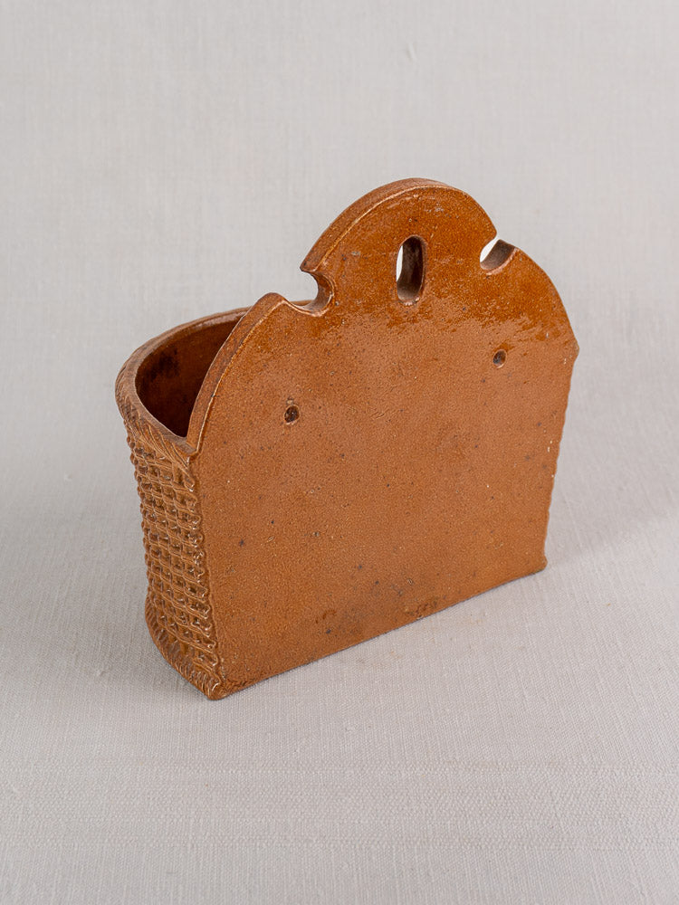 Antique French salt-glazed stoneware salt box with basket-weave detail, rounded top, and oval cutout, late 19th century.