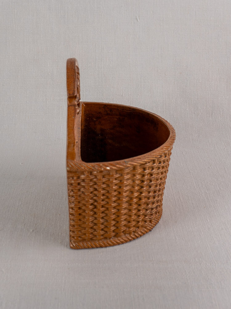 Antique French salt-glazed stoneware salt box, late 19th–early 20th c., flat back for hanging, on light gray background.
