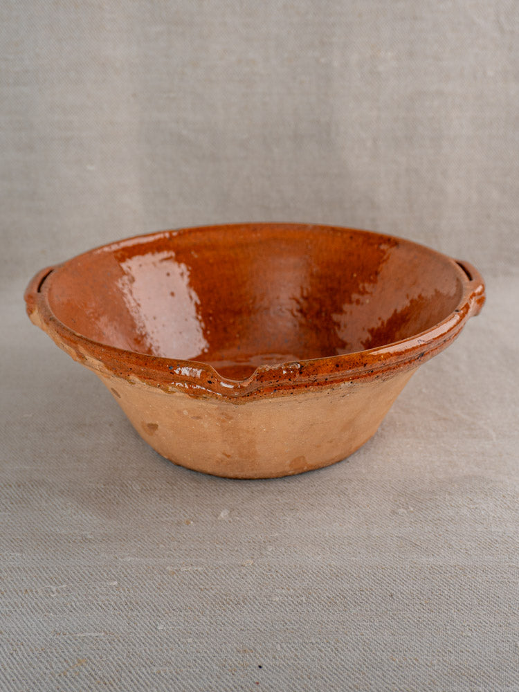 Antique French Languedoc Tian earthenware bowls in rustic brown glaze on neutral fabric background.