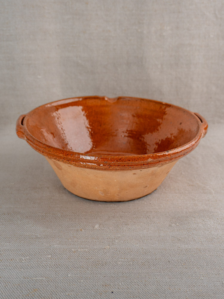 Pair of antique French Languedoc Tian bowls in glazed earthenware, brown finish, on neutral fabric background.