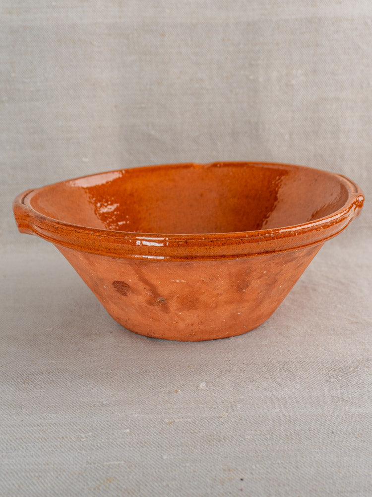 Pair of antique French Languedoc Tian bowls in glazed earthenware with reddish-brown finish, on textured fabric.