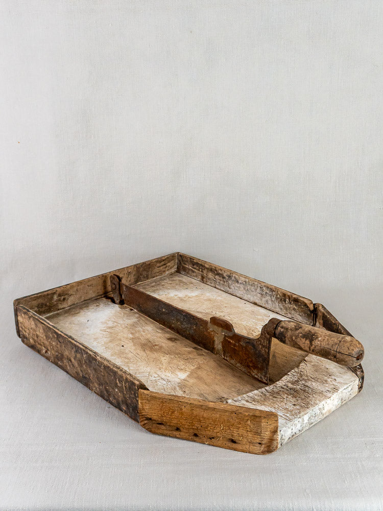 French antique wood and iron Coupe-Tabac tobacco cutter with timeworn patina on neutral surface.