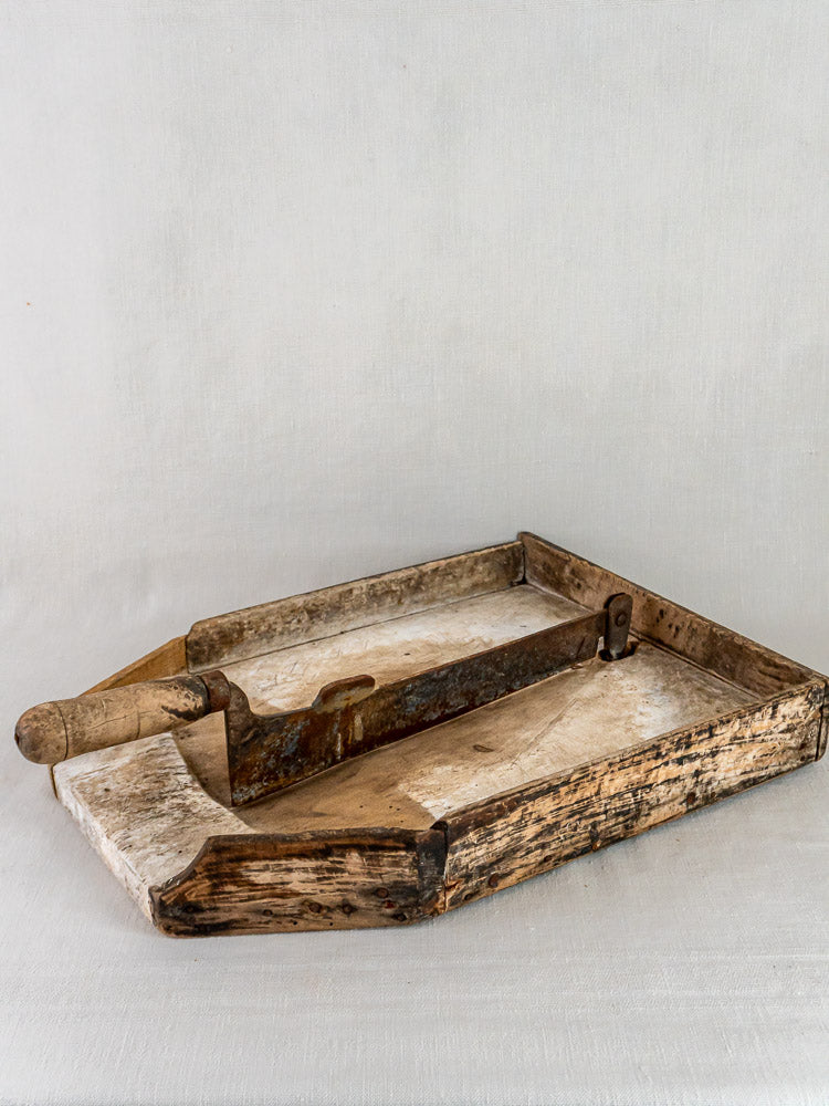 Antique French coupe-tabac tobacco cutter in wood and iron with handle, showcasing aged patina.