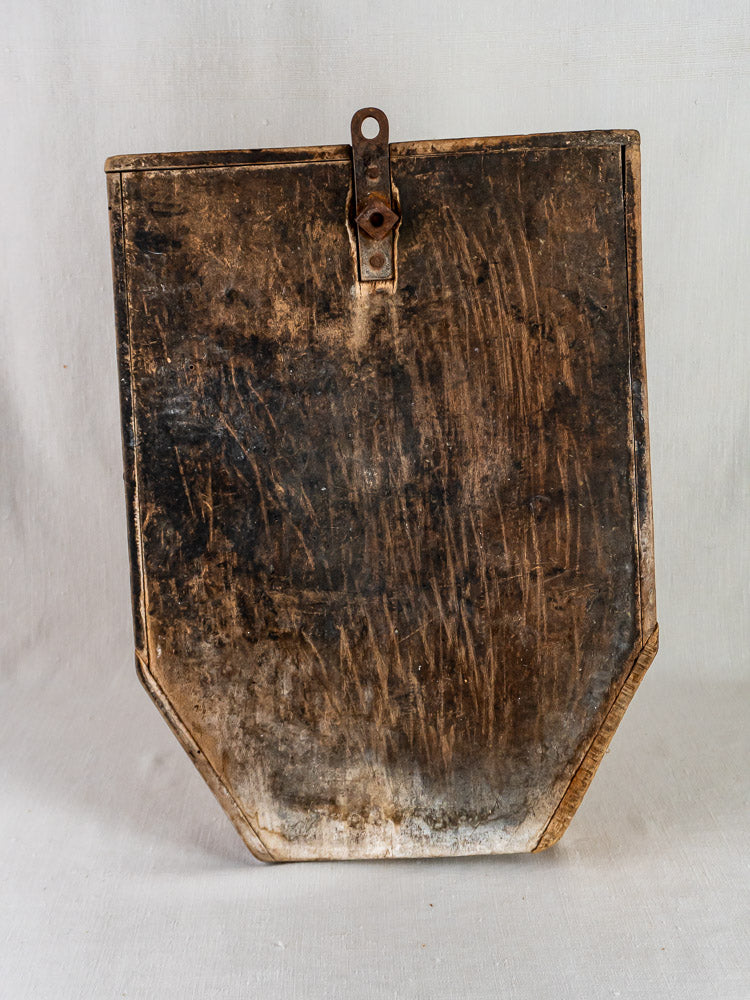 Antique French wood and iron Coupe-Tabac tobacco cutter with rounded base and hanging loop.