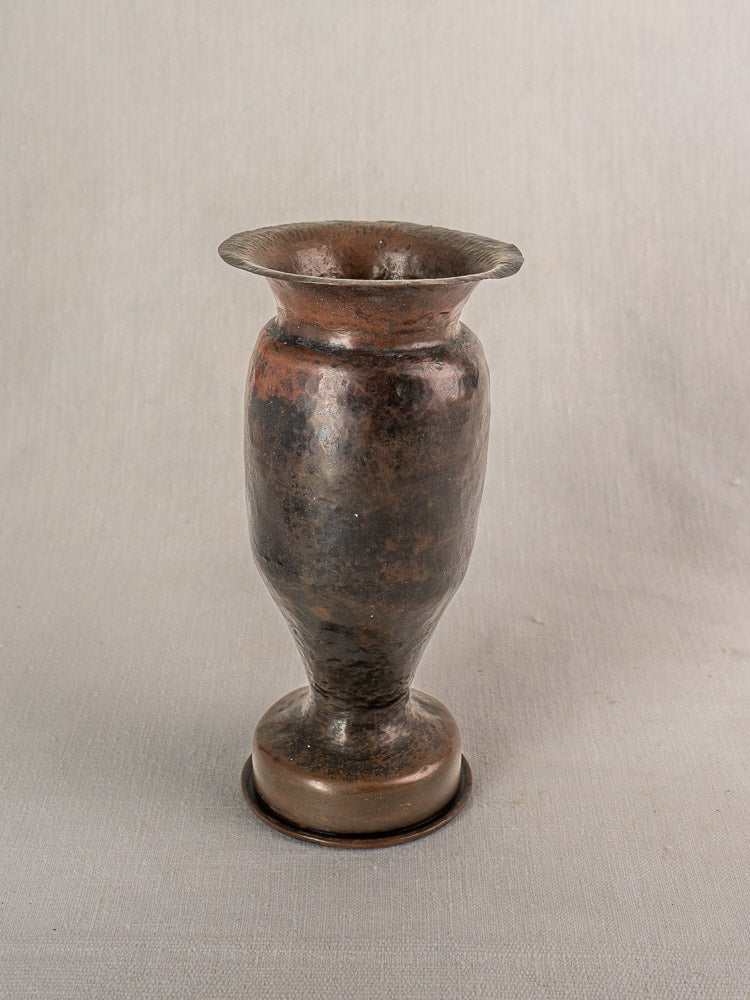 Antique French trench art vase from 1917 WWI shell casing with flared rim and martelé finish.