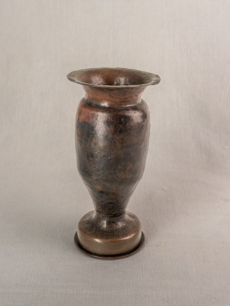 Antique French trench art vase from 1917 WWI shell casing with flared rim and martelé finish.