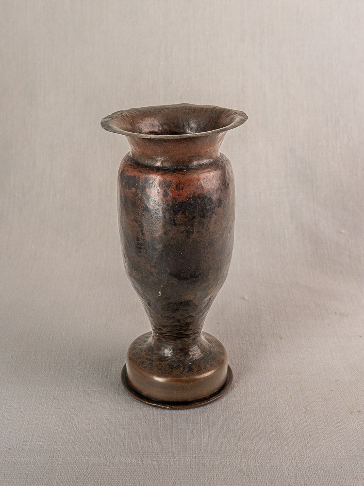 Antique French Trench Art vase from 1917 shell casing with flared rim and aged patina.
