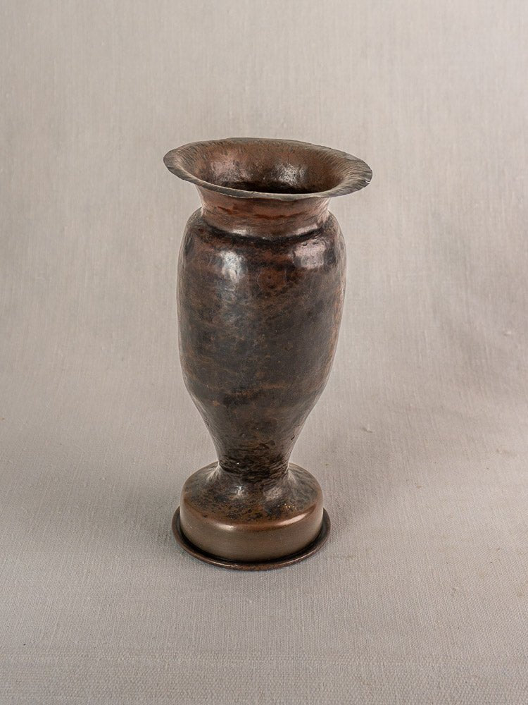 Antique French WWI trench art vase, bronze-colored metal with flared rim and martelé finish.