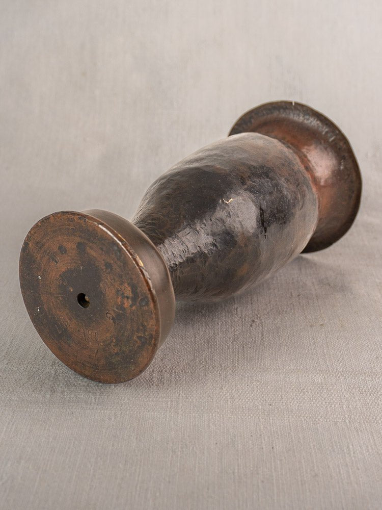 Antique French trench art vase crafted from a 1917 WWI shell casing with worn metallic patina.