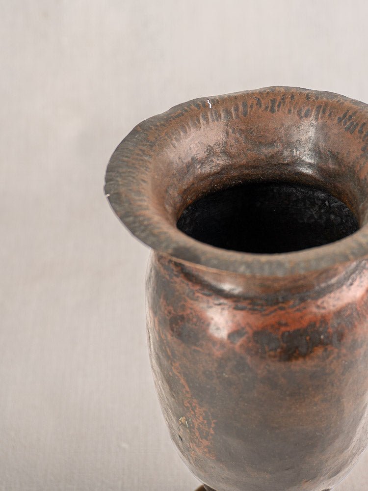 Antique French WWI trench art vase, brown-black ceramic, flared rim, martelé texture, light background.