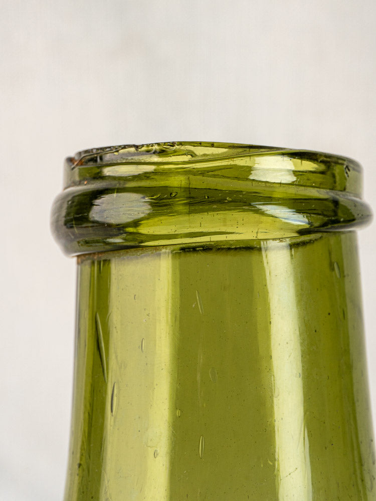 Antique French truffle bottle in hand-blown olive glass, 19th century, rim and neck detail.