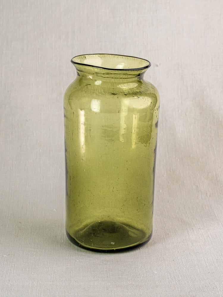 Antique French olive green hand-blown glass preserve jar, late 18th century, with tall cylindrical shape and flared rim.